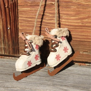 Pair of white wooden skates with red flake