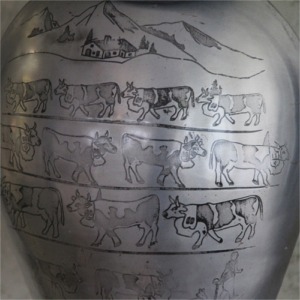 Cloche sculptée poya