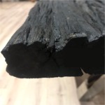 table en vieux teck noir  avec 2 pieds croisés chrome